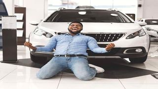 An excited man after buying a car.