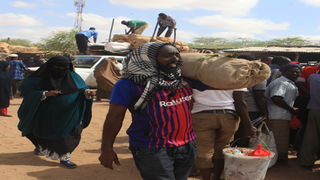 Traders offload miraa at a market in Mandera.