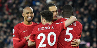 Liverpool's Dutch defender Virgil van Dijk (second right) celebrates with teammates 