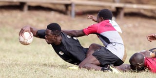 Johnstone Waiganjo (left) of Impala RFC goes for the try line during their Kenya Cup league match against Kenya Harlequins