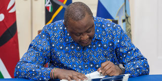 President Uhuru Kenyatta signs Bills