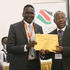 NOC-K president Paul Tergat receives certificate from Returning Officer Joshua Okumbe 