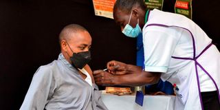 A man receives Covis vaccine