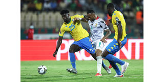 Ghana's forward Jordan Ayew vies for the ball with Gabon's midfielder Junior Assoumou