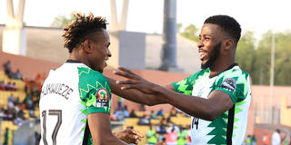 Nigeria's forward Samuel Chukwueze (left) celebrates with team mate Kelechi Iheanacho 