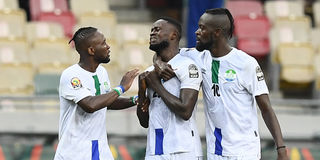 Sierra Leone's forward Musa Noah Kamara (centre) celebrates with team mates Kei Kamara (right) and Mohamed Buya Turay 