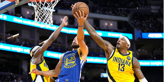 Torrey Craig #13 of the Indiana Pacers blocks the shot of Stephen Curry #30 of the Golden State Warriors 