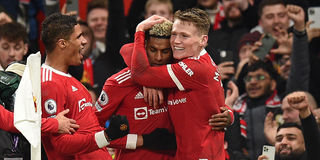Manchester United's Marcus Rashford celebrates with McTominay and Varane