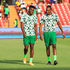 Nigeria's forward Taiwo Awoniyi (left) and team mate Joe Aribo warm up 