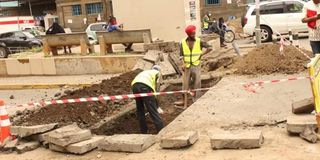 Workers building pedestrian walkways Nakuru CBD,
