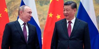 Russian President Vladimir Putin (left) and Chinese President Xi Jinping meet