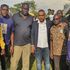 Twaha Mbarak poses with fans during the burial of football fan Isaac Juma