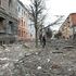 A pedestrian walks amid debris in Ukraine's second-biggest city of Kharkiv