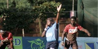 Centre Referee Godwin Karuga gives direction of play 
