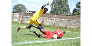 Brian Mandela of Fortune Sacco (left) battles for the ball with Frank Ouya of Shabana 