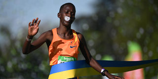 Kenya's Judith Jeptum crosses the finish line to win the 46th edition of the Paris Marathon women's race