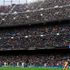 Supporters cheer during the women's Uefa Champions League quarter-final second leg match between FC Barcelona and Real Madrid CF