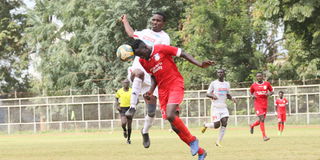Posta Rangers forward Francis Nambute vies with Bandari defender Andrew Juma 