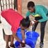 Kitengela girl washing clothes for fees