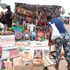 A woman admires artworks at the Africities cultural business and entertainment village 