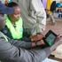 IEBC clerks verifying a voter’s details in Nakuru. 