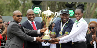 KCB captain and coach present African title to CEO Paul Russo