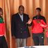 Malkia Strikers players and Charles Nyaberi