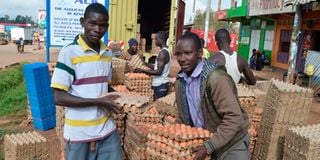 Workers in Kakamega offload eggs imported from Uganda.