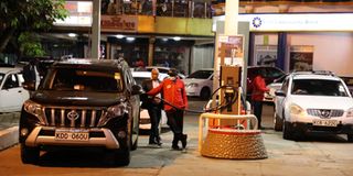 Motorists fuel at Total filling station on Kimathi Street