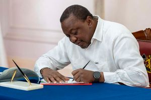 President Uhuru Kenyatta signing parliamentary Bills 