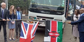 Kenyan and British officials flagging off therapeutic food