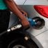 An attendant at a petrol station in Nairobi fuels a customer’s car