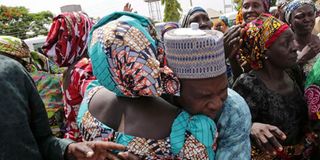 A father being reunited with one of the released Chibok girls in Abuja in 2017
