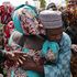 A father being reunited with one of the released Chibok girls in Abuja in 2017