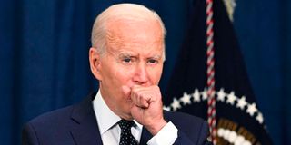 US President Joe Biden coughing