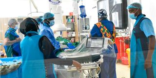 Paediatric-cardiac surgeons and specialists during a closed heart procedure at the Coast General Teaching and Referral Hospital.