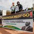 ANC members demonstrate with posters reading “Ramaphosa Must Go”