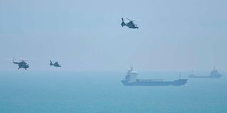 Chinese military helicopters fly past Pingtan island, one of mainland China's closest point from Taiwan