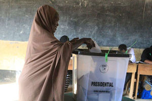 A woman casts her ballot 2017 repeat presidential election