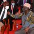 Deputy President William Ruto confers with ODM party leader Raila Odinga