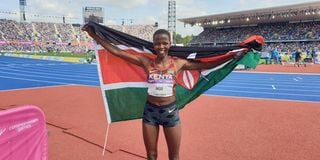 Emily Ngii celebrates after winning a bronze medal