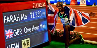 Britain's Mo Farah celebrates after victory and a world record in the men's one-hour event.