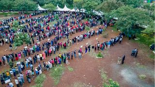 Residents queue to cast their votes at the Kenyatta Sports Ground polling station in Kisumu County.