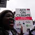 Hundreds of people with placards take part in a demonstration calling for climate change justice for Africa.