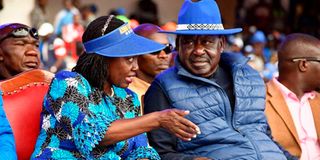 Azimio la Umoja running mate Martha Karua confers with presidential candidate Raila Odinga.
