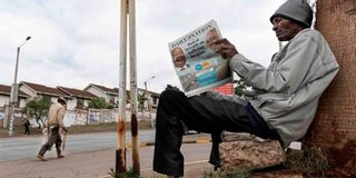 A man reads the Daily Nation newspaper