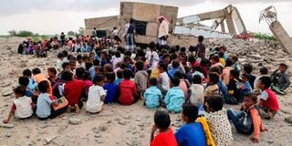 Children attend classes outdoors in Yemen