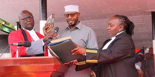 Wajir Governor Abdullahi Ahmed takes the oath of office during his swearing-in ceremony.