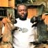 Alee Kagwa Waweru holds different breeds of rabbits