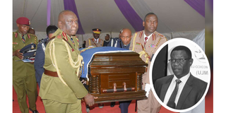 Police officers carry the casket bearing the remains of their departed colleague Charlton Murithi